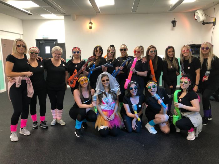 80s hen party dance class Cardiff group having fun with neon outfits